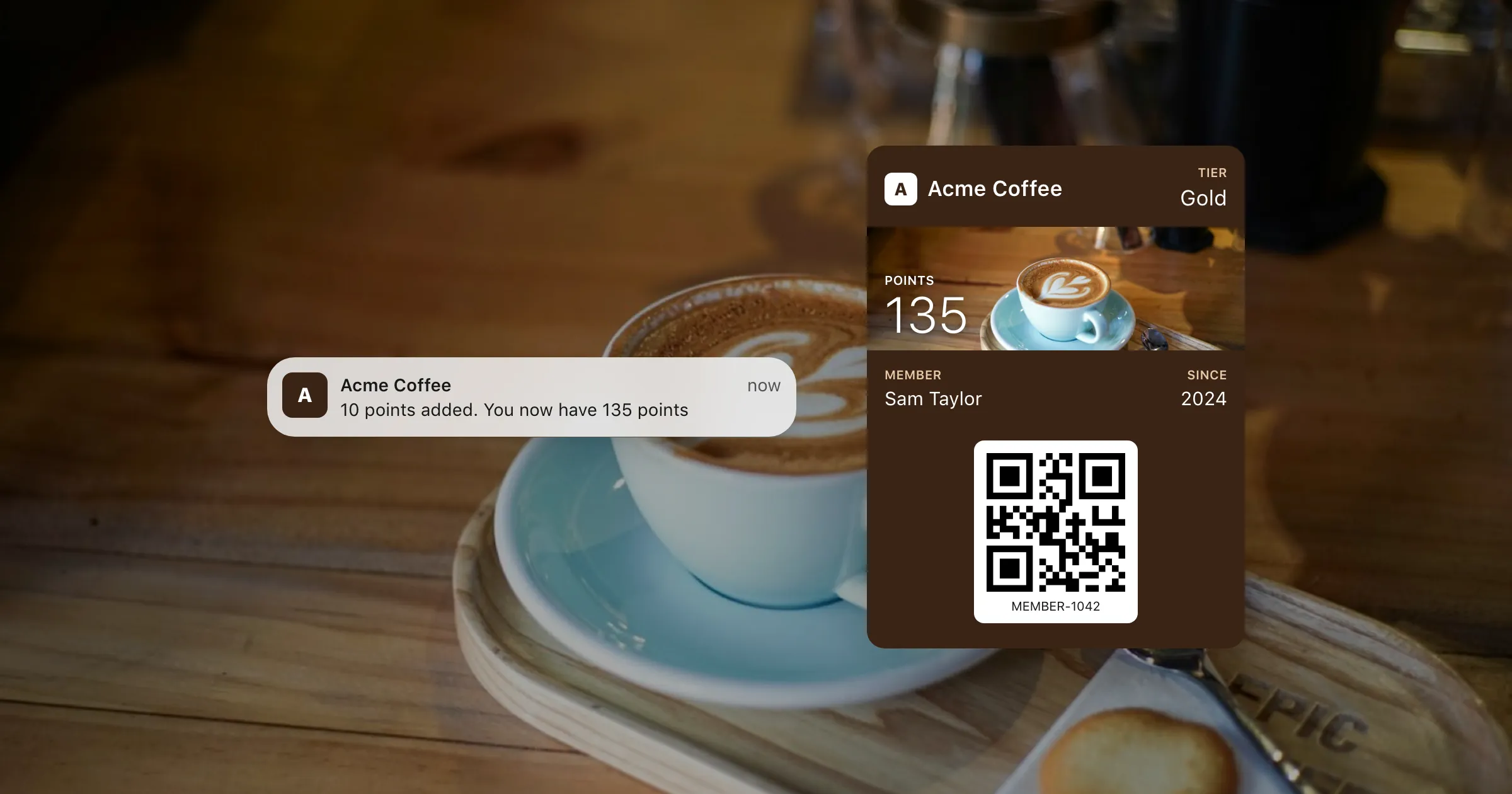 A coffee shop's loyalty card in Apple Wallet over a photo of a cappuccino, with a notification saying the member now has 135 points.
